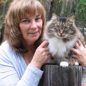Judy poses with Prissy, her adopted cat
